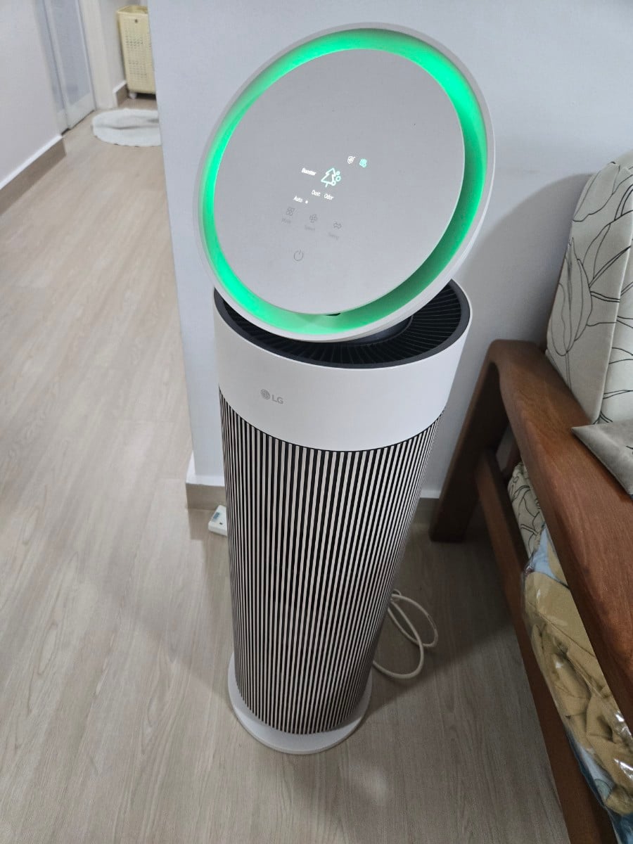 LG AeroBooster Air Purifier with its green clean-air indicator illuminated