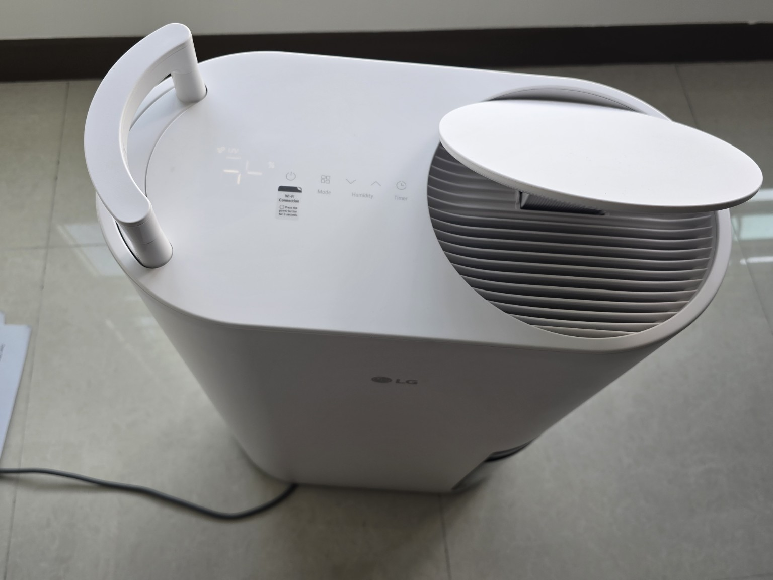 Top controls and air outlet of an LG Dual Inverter Dehumidifier